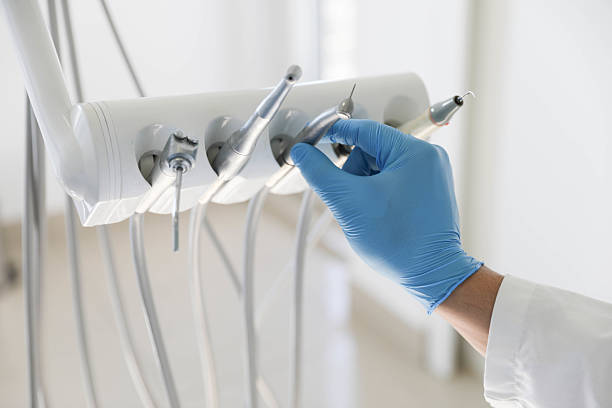 Professional Tooth Extraction technician working in South Roxana, IL
